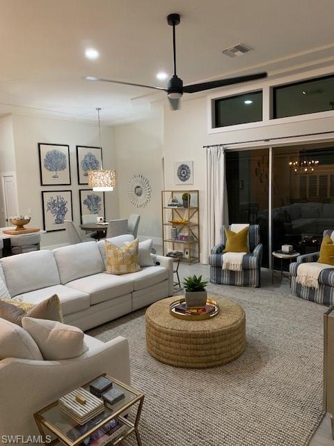 Living room featuring a chandelier and recessed lighting