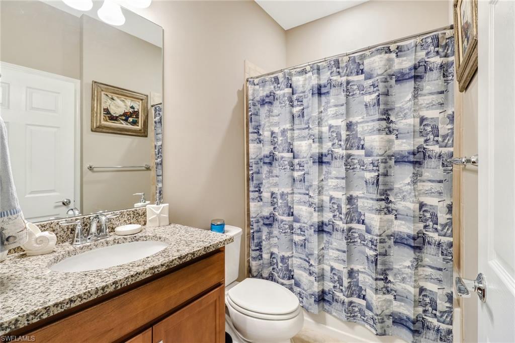 Full bathroom with toilet and vanity