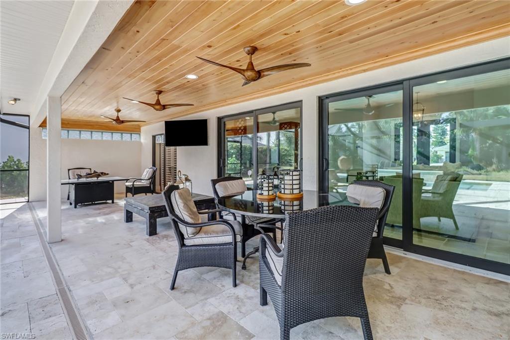 View of patio / terrace featuring outdoor dining area and a ceiling fan