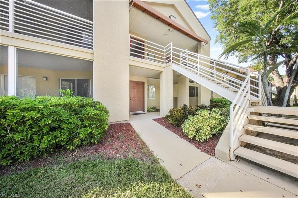 Property entrance featuring stucco siding