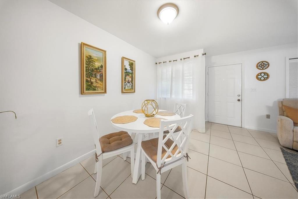 Dining room featuring light tile patterned floors