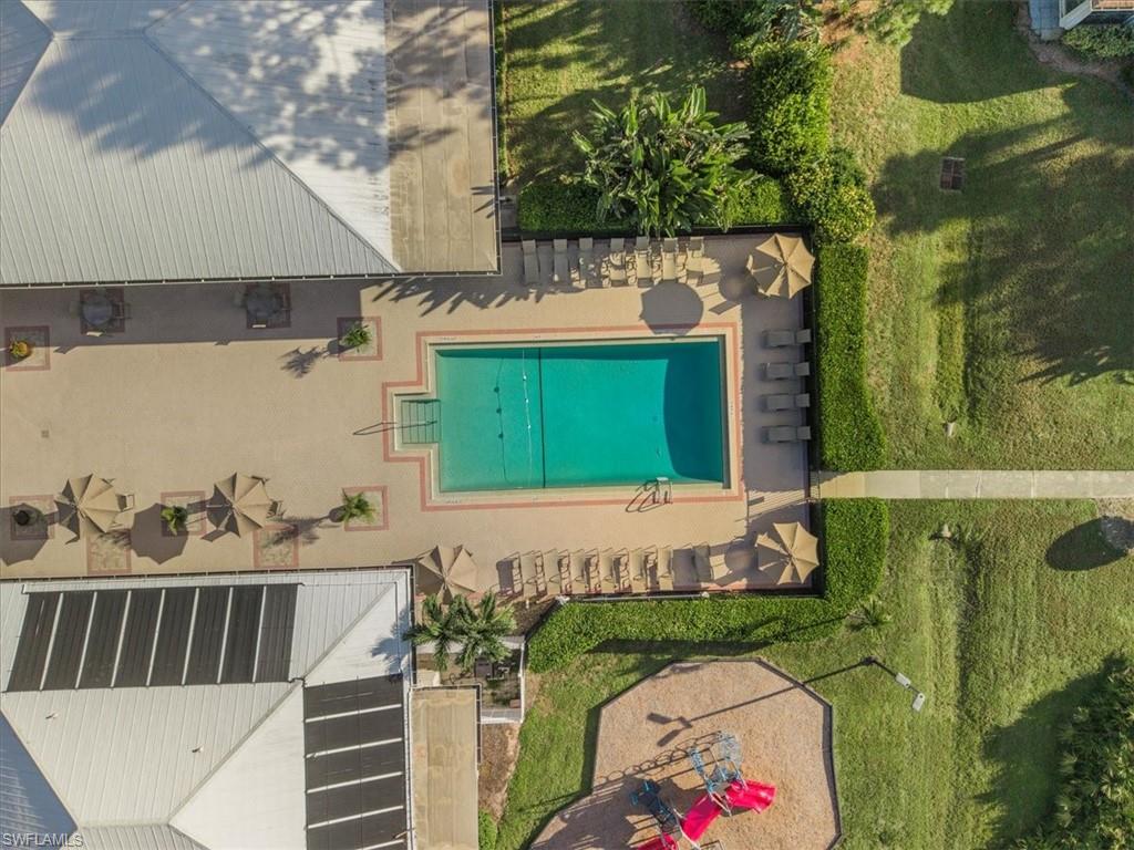 Aerial view of property and surrounding area with a pool