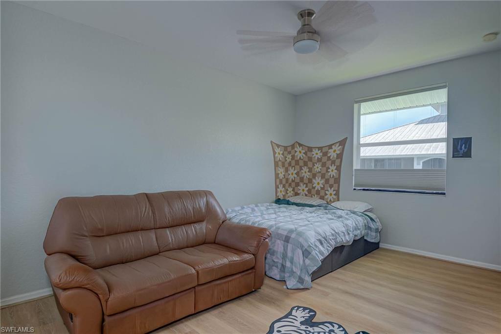 Bedroom featuring light wood finished floors and a ceiling fan