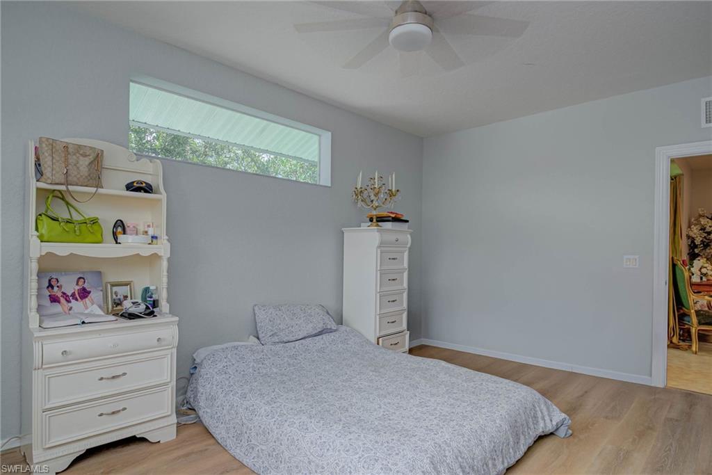 Bedroom with light wood-style flooring and ceiling fan