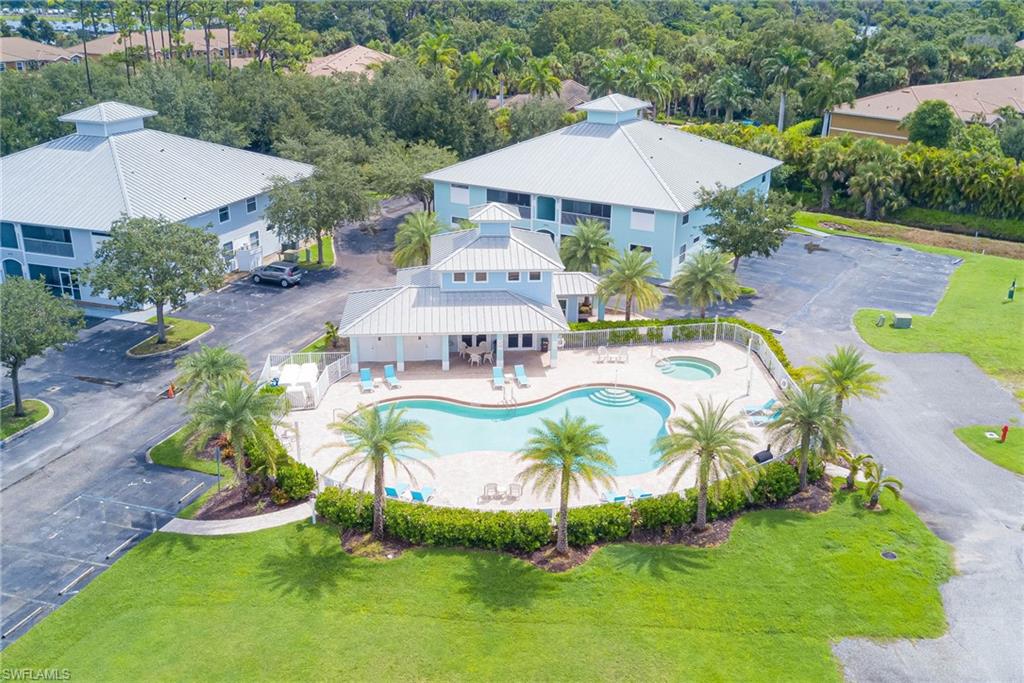 Aerial view of property and surrounding area with a pool