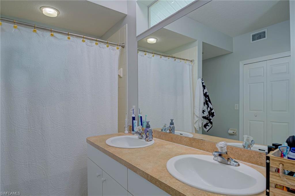 Bathroom featuring double vanity