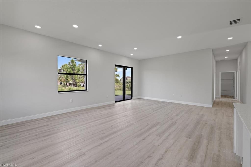 Spare room featuring recessed lighting and light wood-style flooring
