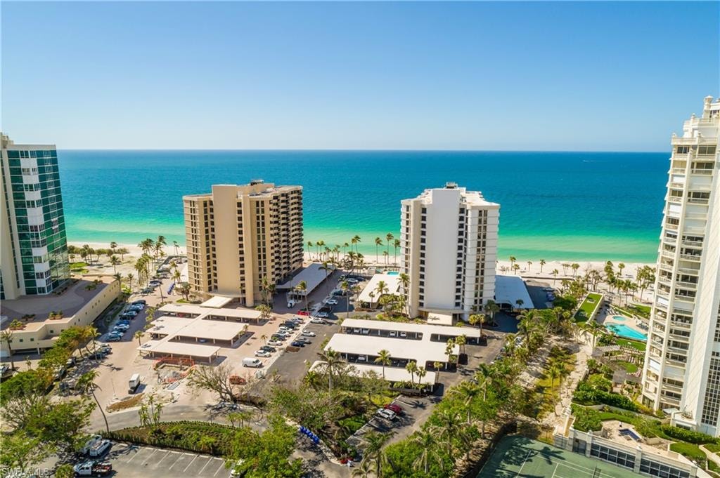 Aerial view of extended coastline and apartment complex / building