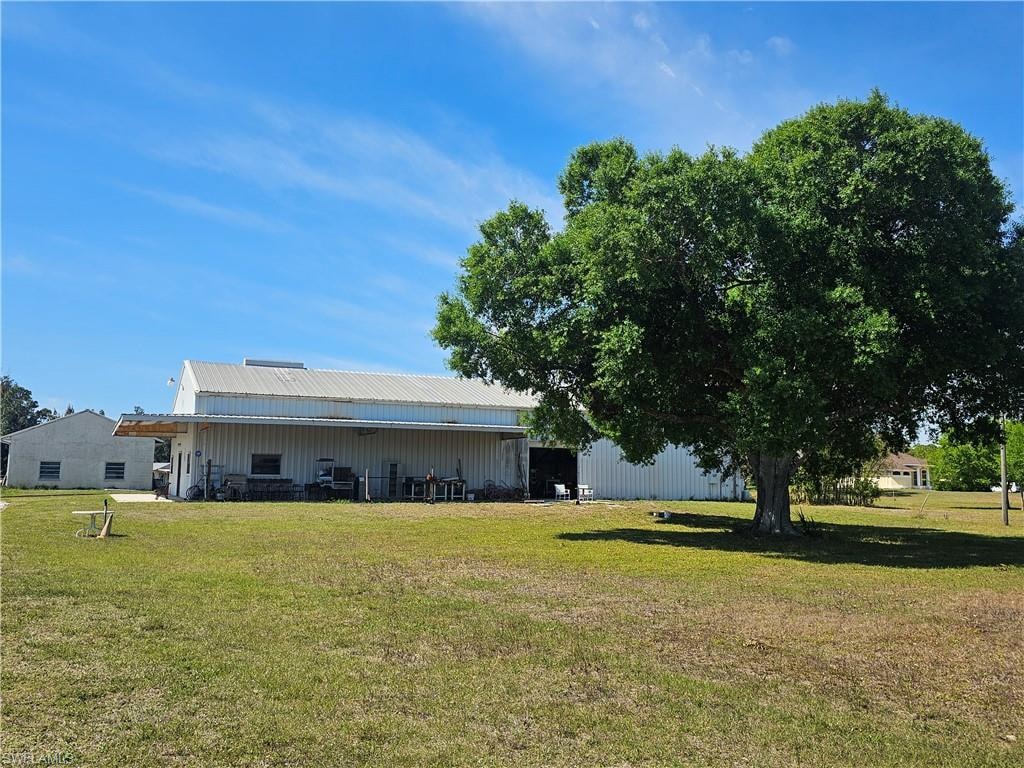 View of yard featuring an outbuilding and an outdoor structure