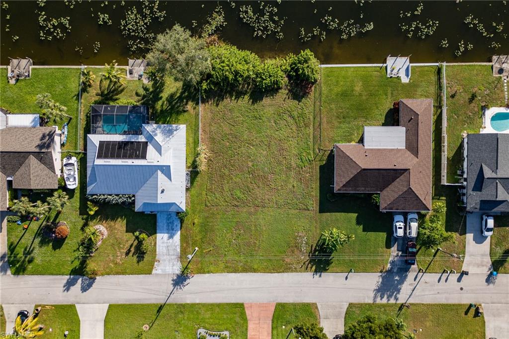 Neighbors each have a fenced yard.