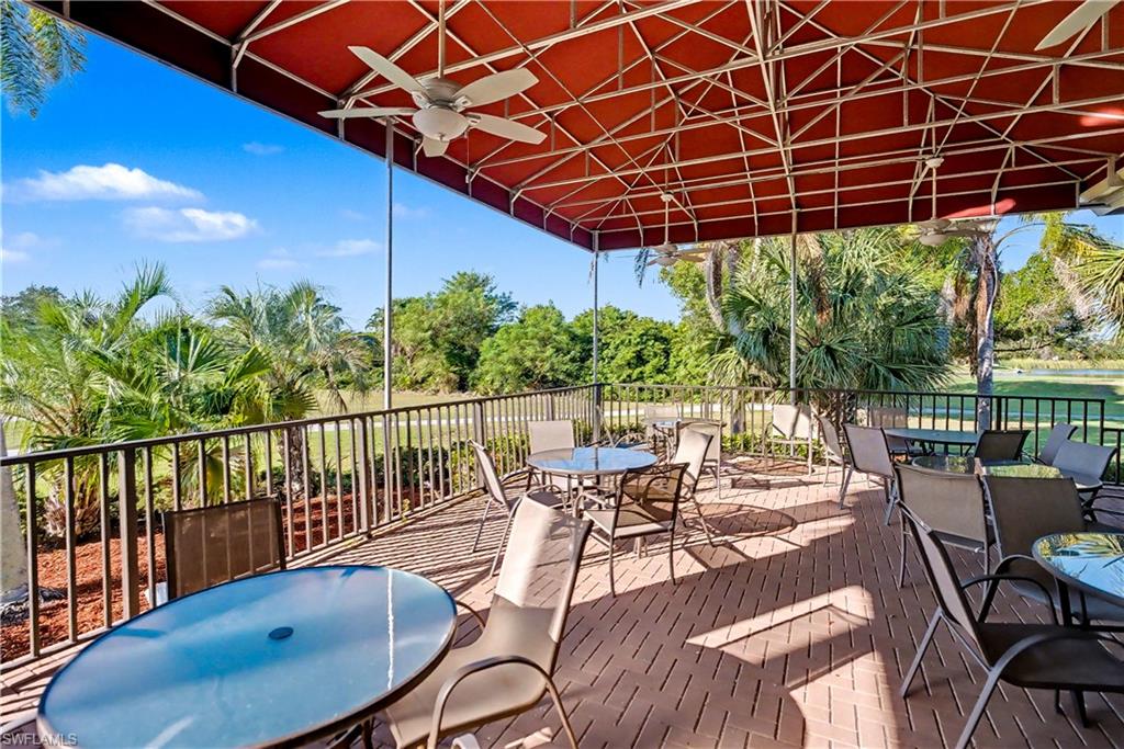 Deck with outdoor dining space and a ceiling fan