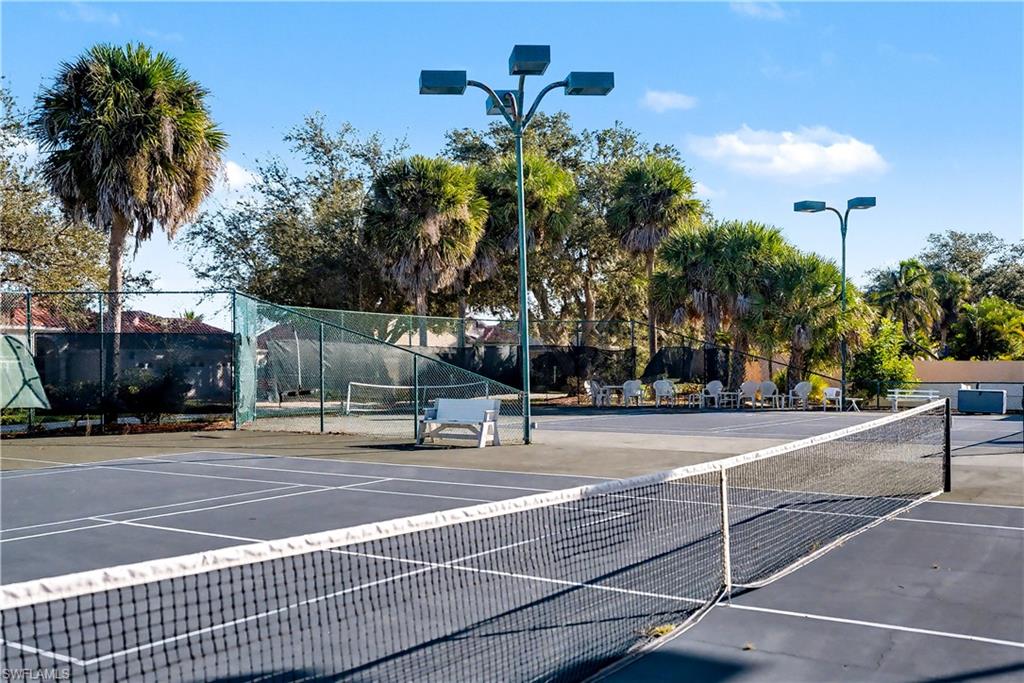 View of tennis court featuring community basketball court