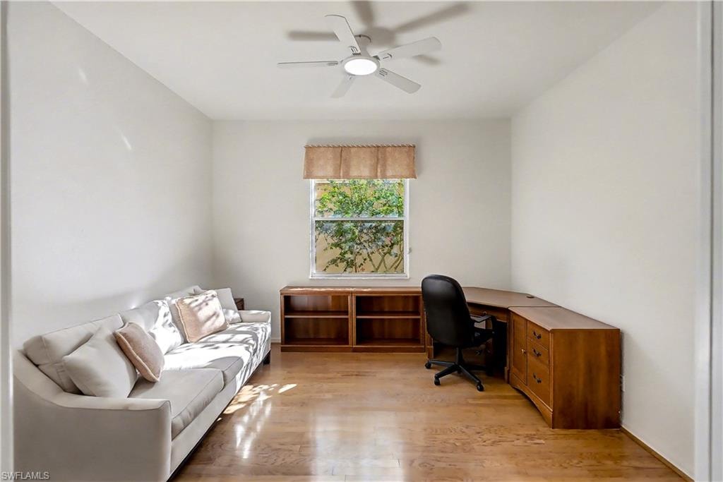 Office space featuring light wood-type flooring and a ceiling fan