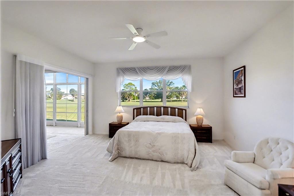Bedroom with carpet flooring, access to exterior, and a ceiling fan