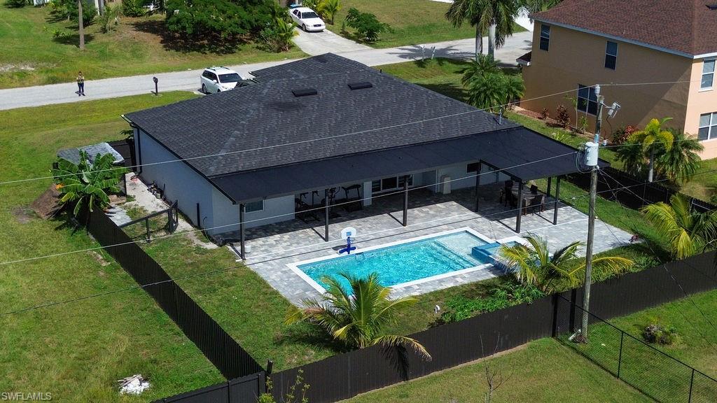 View of swimming pool featuring a patio and a fenced backyard