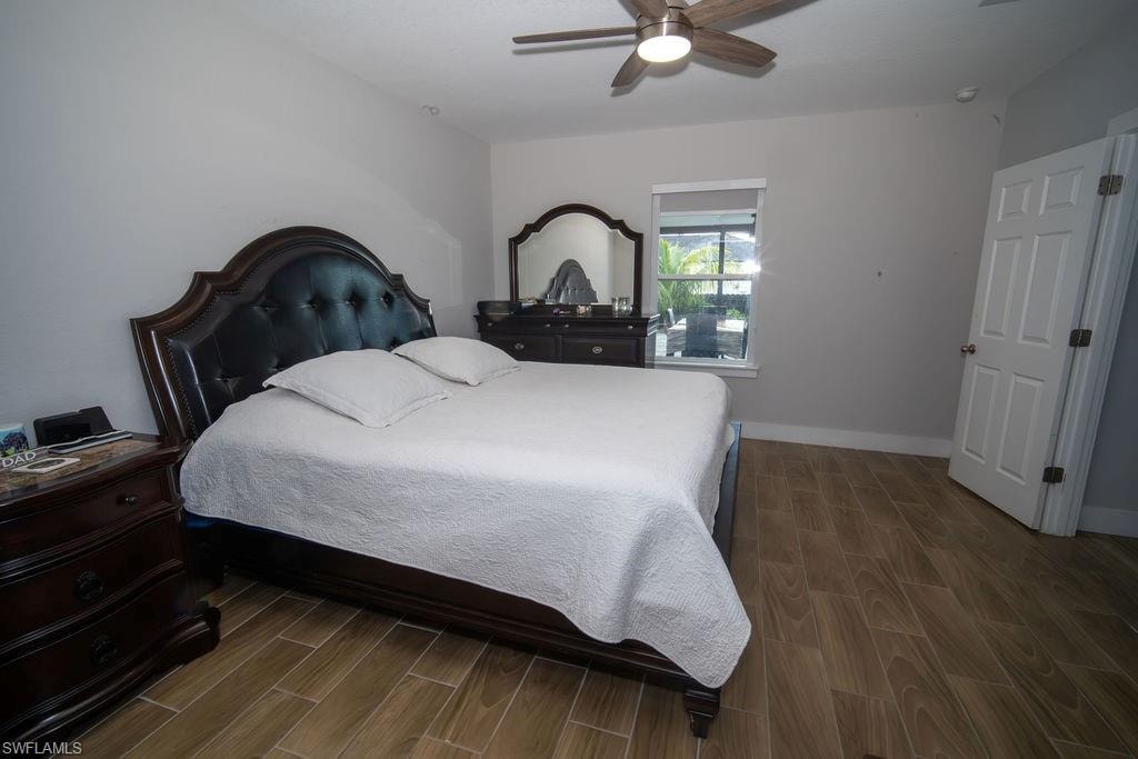 Bedroom with wood finish floors and a ceiling fan