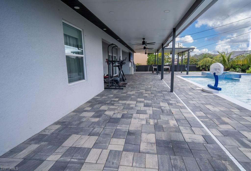 View of patio with a ceiling fan