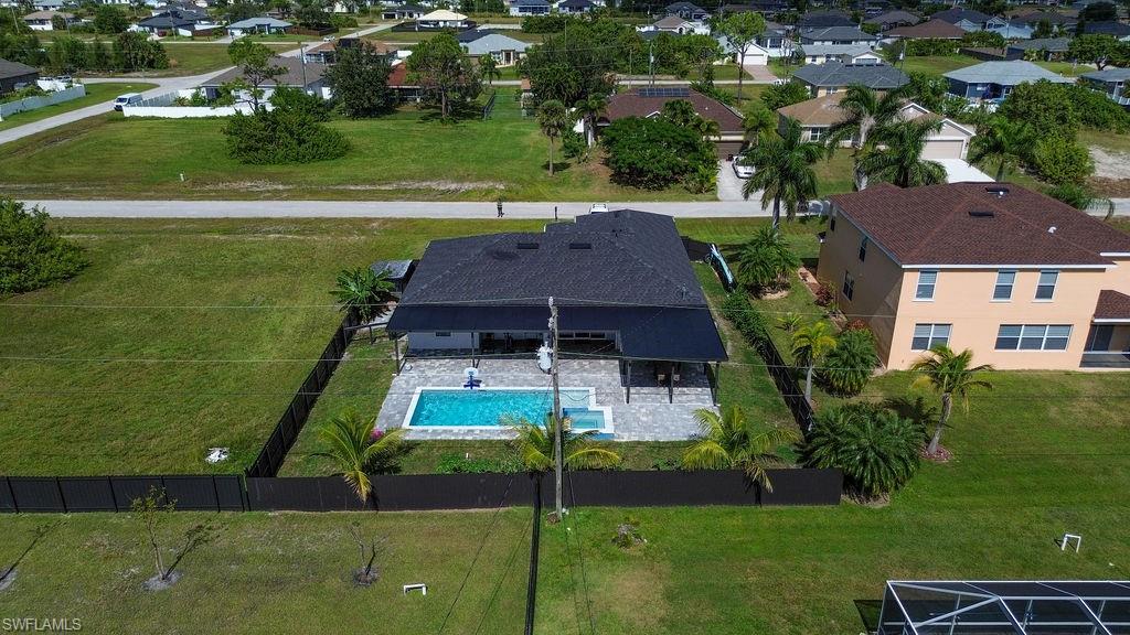 Aerial overview of property's location with a pool area