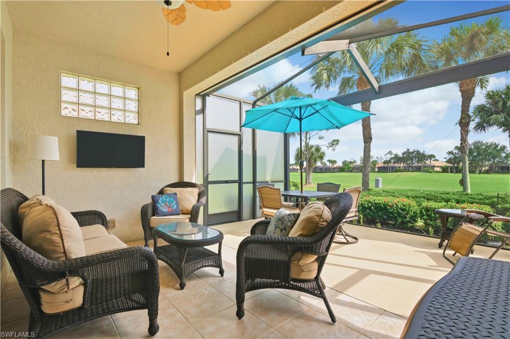 Sunroom / solarium featuring ceiling fan, an outdoor hangout area, and a patio