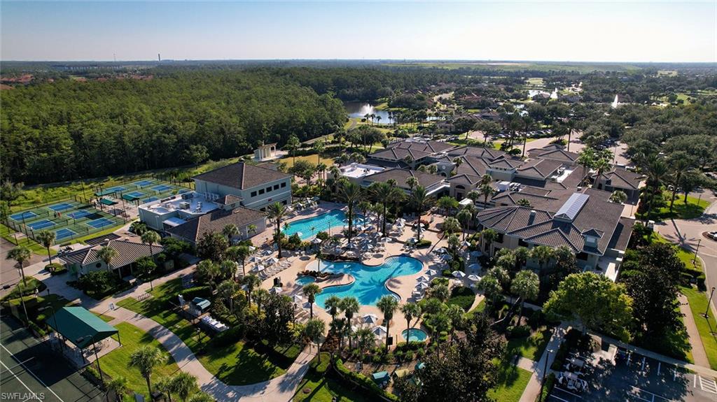 Aerial view of a pool and a nearby body of water