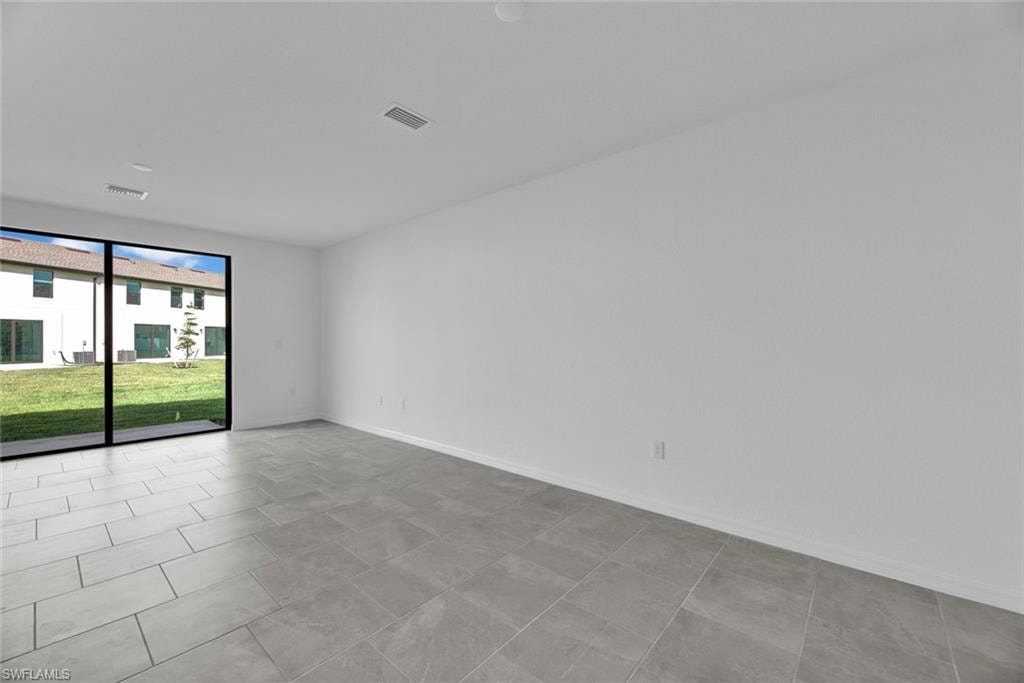 Unfurnished room with baseboards
