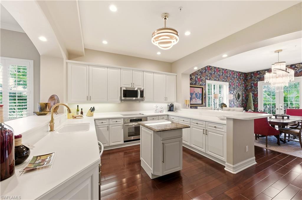 Giant kitchen open to living & dining/Family rooms