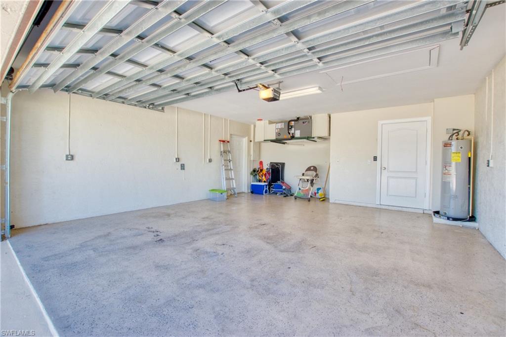 Garage featuring water heater