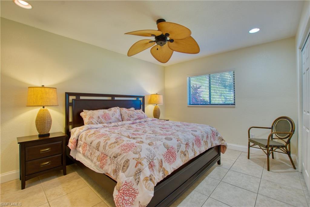 Bedroom featuring recessed lighting, light tile patterned floors, and a ceiling fan