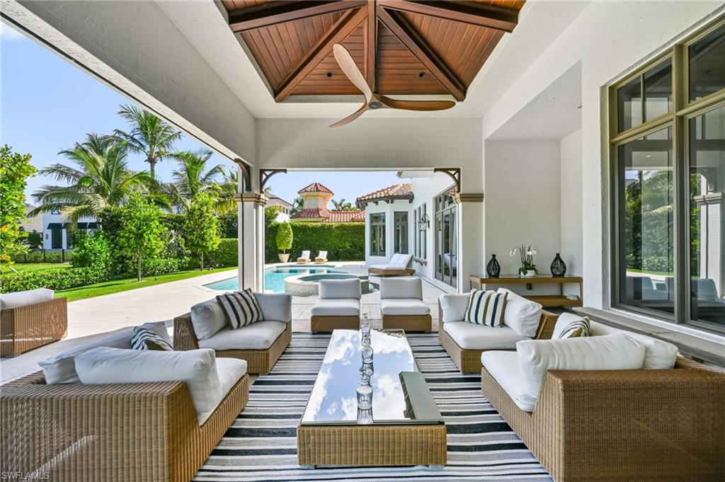 View of patio with a ceiling fan, outdoor lounge area, and an outdoor pool