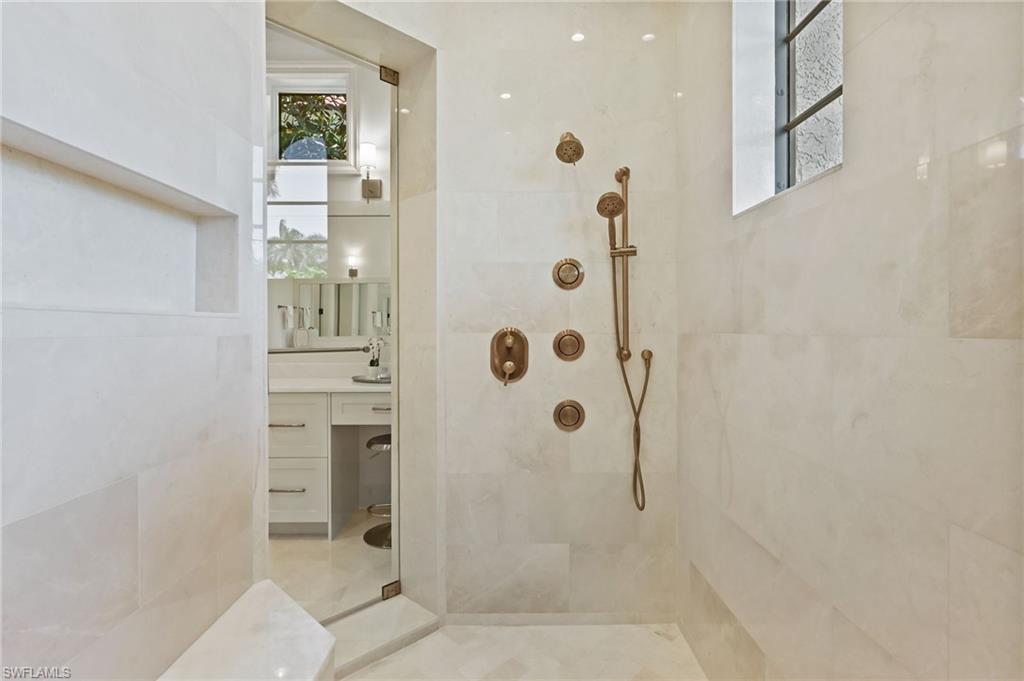 Full bath with vanity and a walk in shower