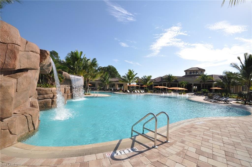Community pool featuring a patio area