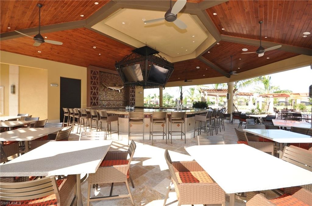 Dining room with ceiling fan and wood ceiling