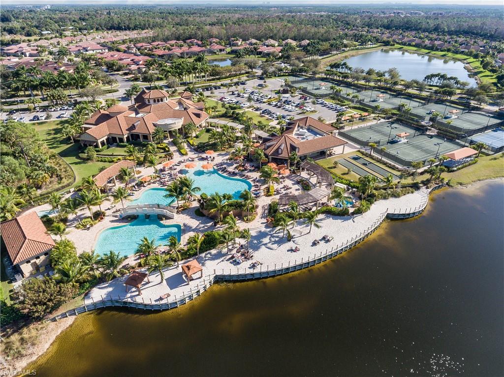 View of property location featuring a nearby body of water and nearby suburban area