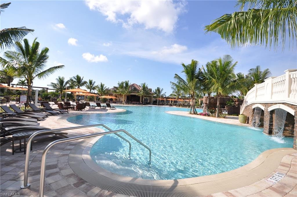 Community pool with a patio