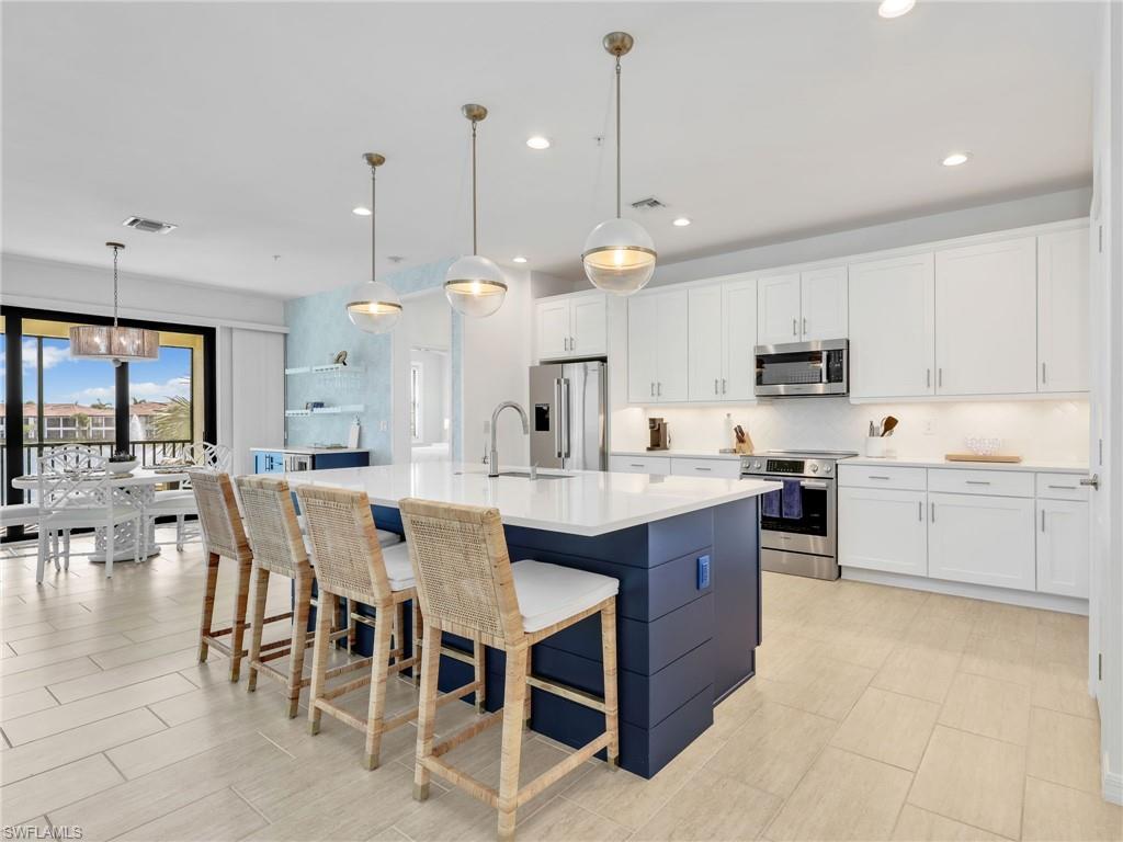 Kitchen and Dining Area with Bar and Beverage Fridge