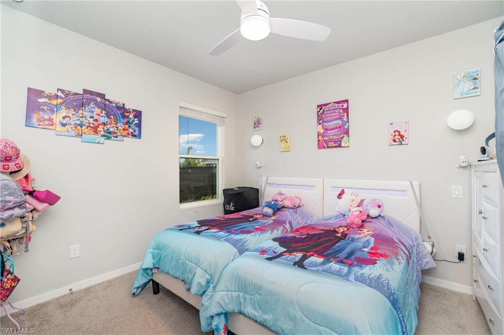 Bedroom with carpet and a ceiling fan