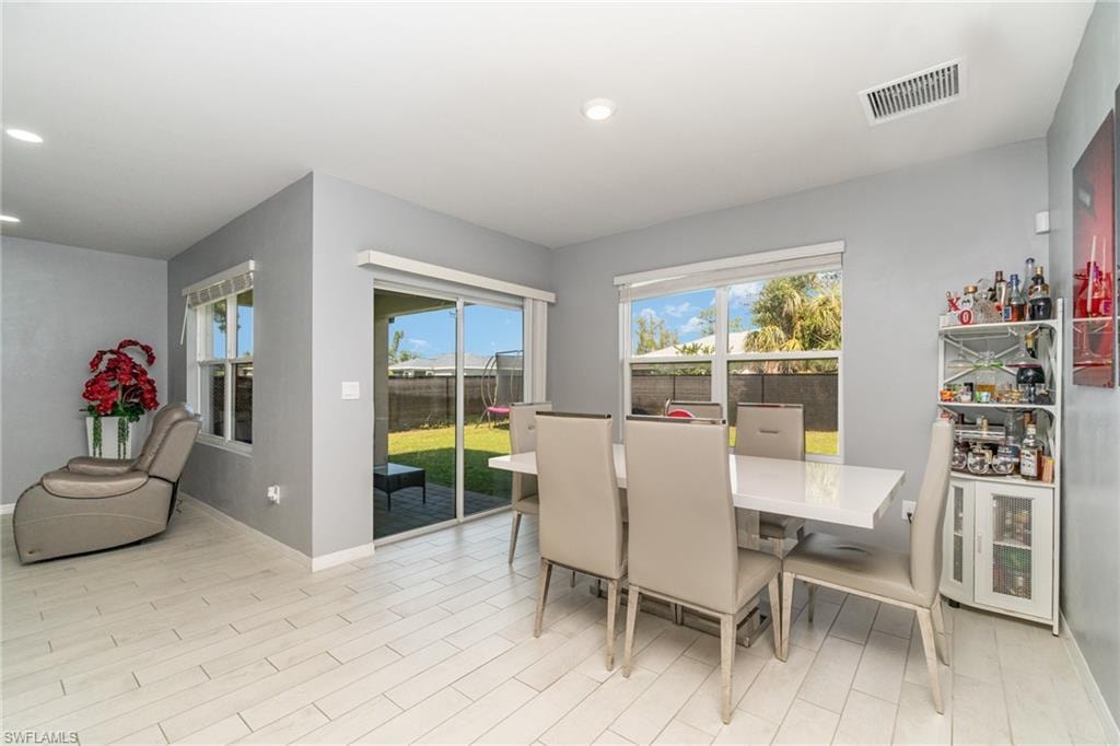 Dining space featuring healthy amount of natural light, recessed lighting, and light wood-style flooring