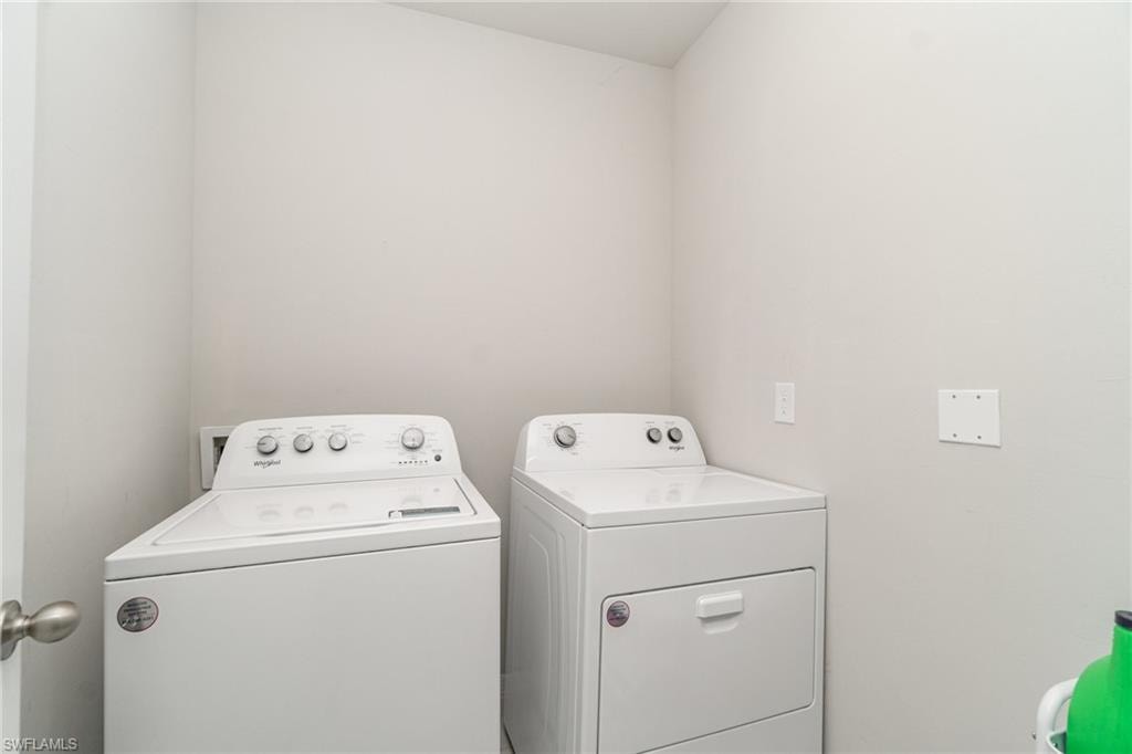 Laundry room with washing machine and dryer