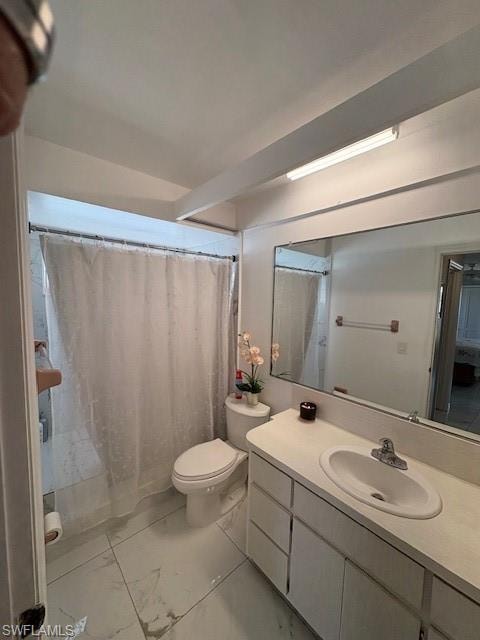 Bathroom with vanity, a shower with curtain, and light marble finish floors