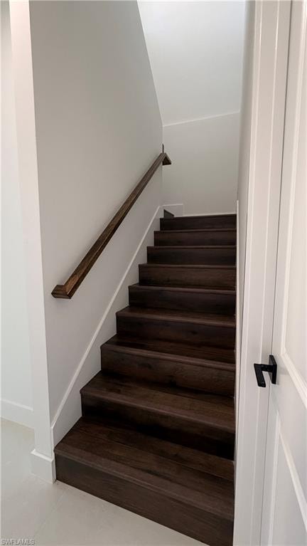 Stairs featuring tile patterned floors