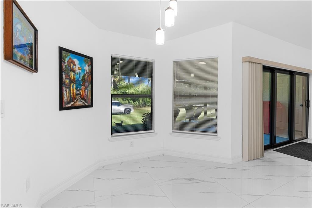 Empty room with light marble finish floors and baseboards
