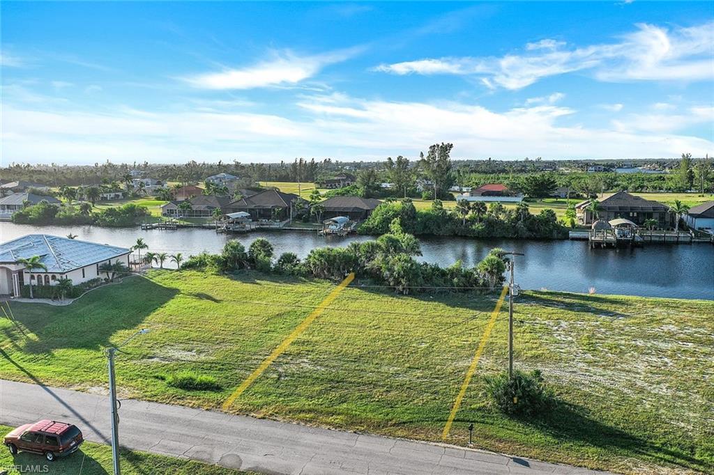 Aerial perspective of suburban area with a nearby body of water