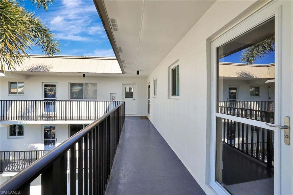 Bedroom with access to exterior and multiple windows