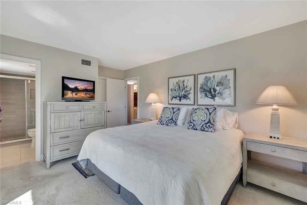 Living area featuring light tile patterned floors and baseboards
