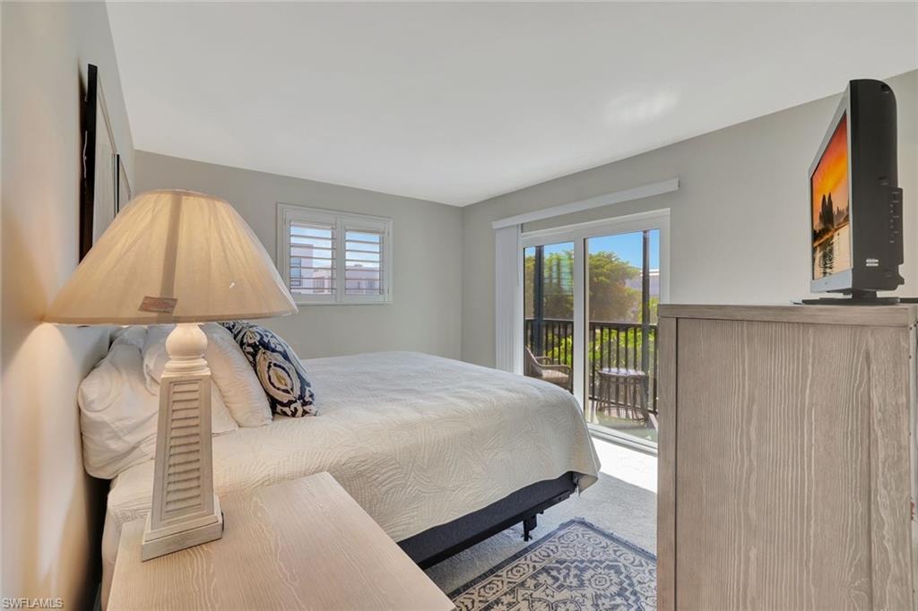 Living room with light tile patterned floors and baseboards
