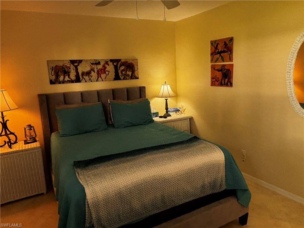 Bedroom featuring carpet flooring and ceiling fan