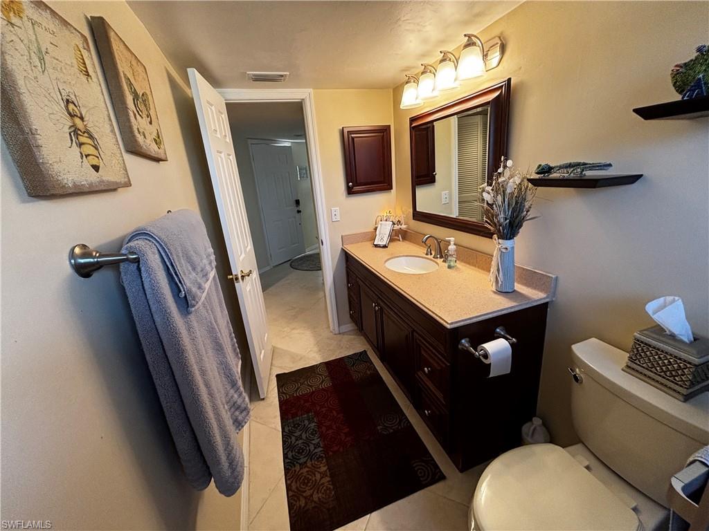 Bathroom featuring vanity and light tile patterned flooring