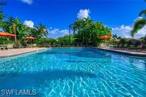 Community pool featuring a patio