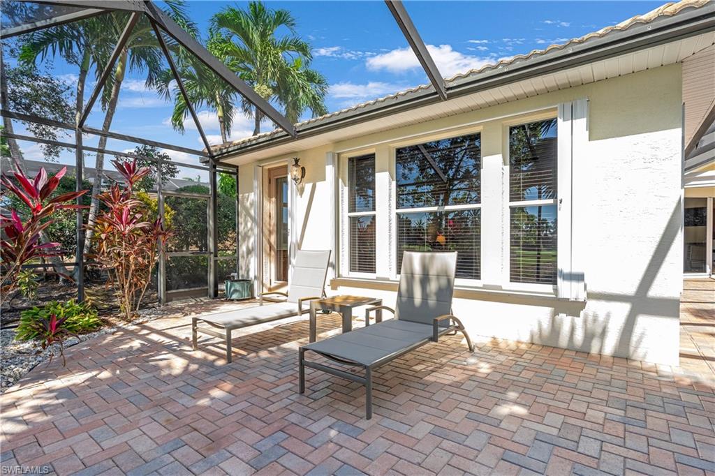 View of patio / terrace featuring a sunroom and glass enclosure