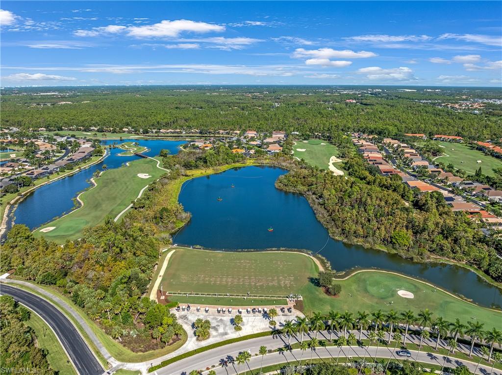 Aerial overview of property's location with a golf course and nearby suburban area